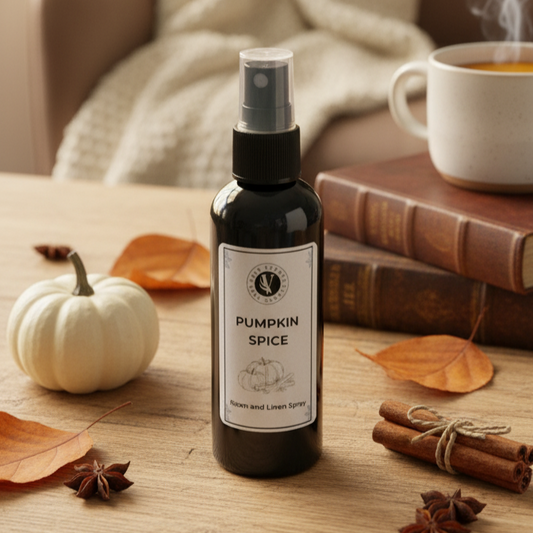 Pumpkin spice spray bottle on a wooden table with a cozy background